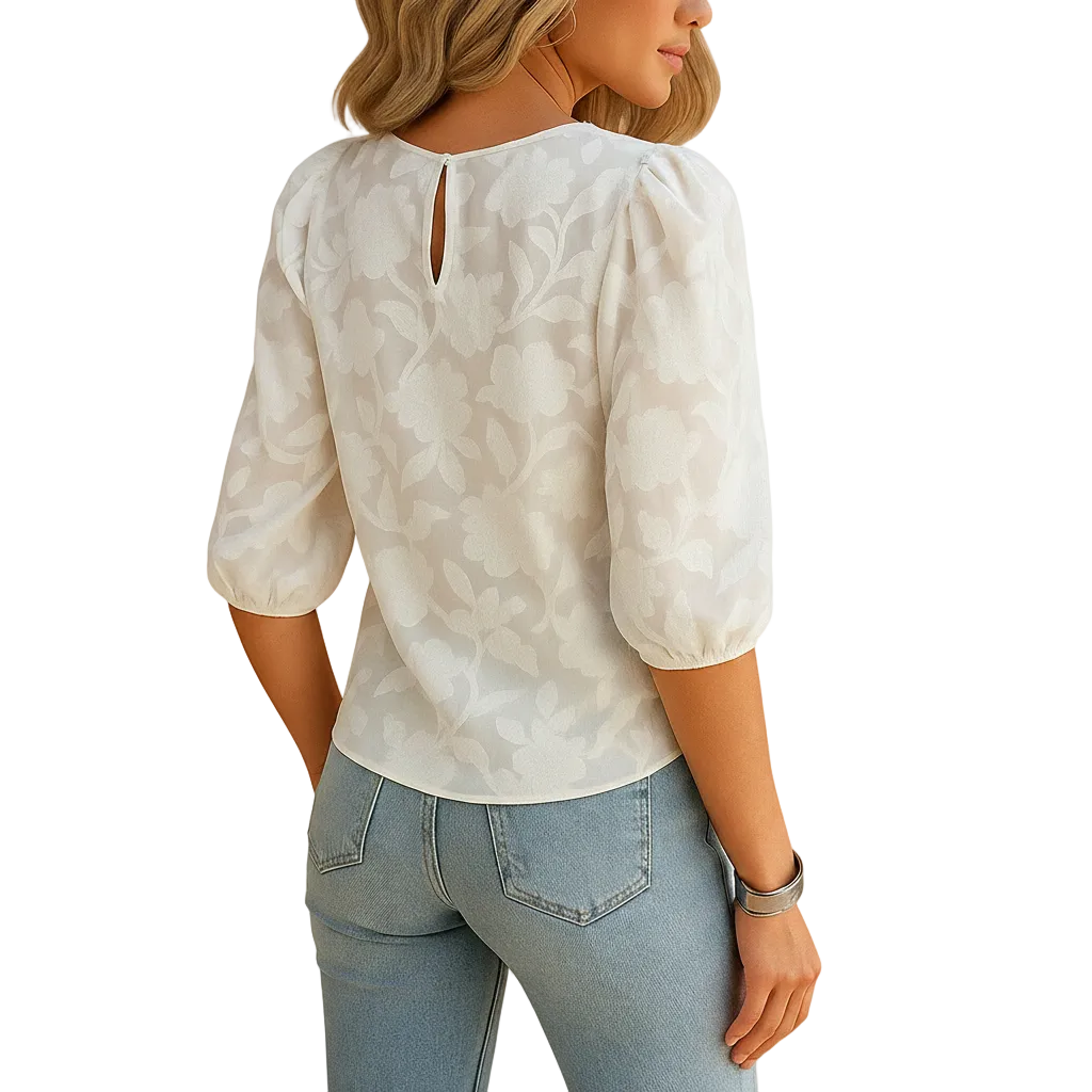 Close-up of floral pattern on white blouse